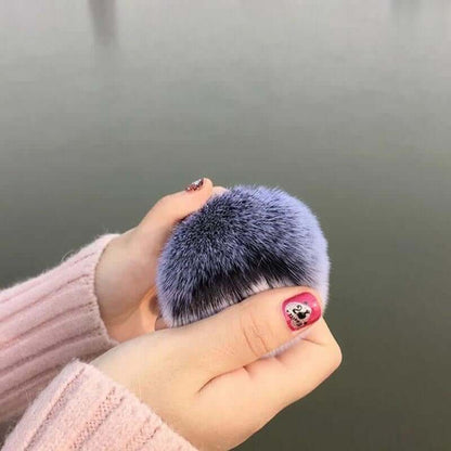 Face makeup brush with soft dense bristles on a neutral background