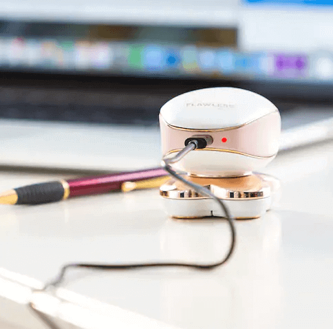 women's hair remover charging via USB cable