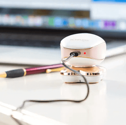 women's hair remover charging via USB cable