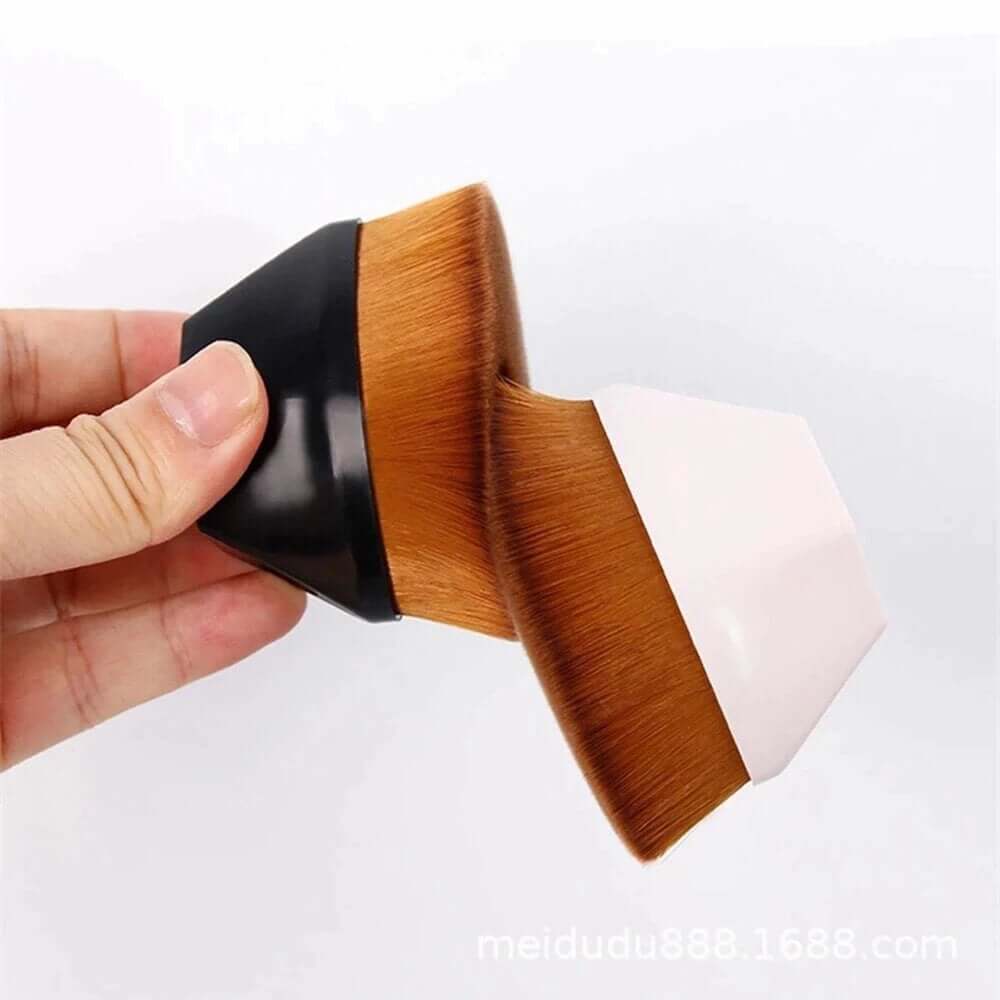 Foundation makeup brush held in hand for smooth makeup application